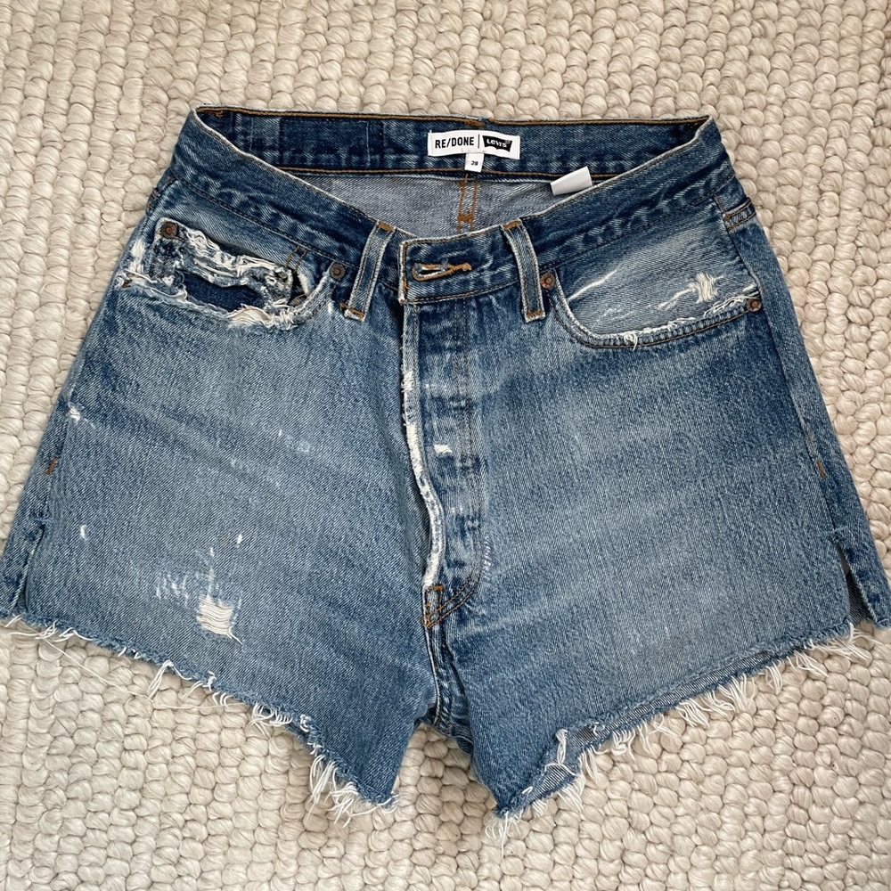 Re/done Levi’s cutoff denim shorts in classic light wash, size 28.